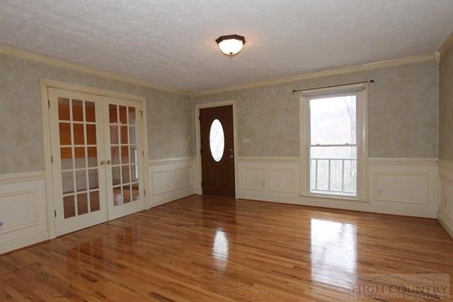 993 Hopewell Church Road Boone, NC 28607 - Photo 8 of 15 a view of a livingroom with wooden floor and a large window