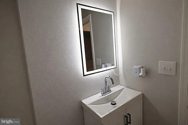 a bathroom with a sink and a toilet