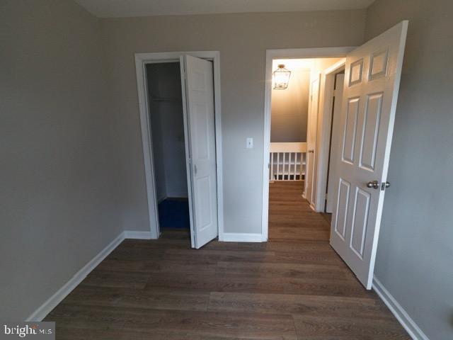 139 Spruance Road Dover, DE 19901 - Photo 19 of 21 a view of a hallway with wooden floor and staircase