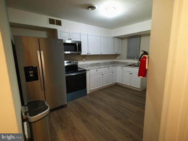 139 Spruance Road Dover, DE 19901 - Photo 3 of 21 a kitchen with stainless steel appliances granite countertop a refrigerator and a sink
