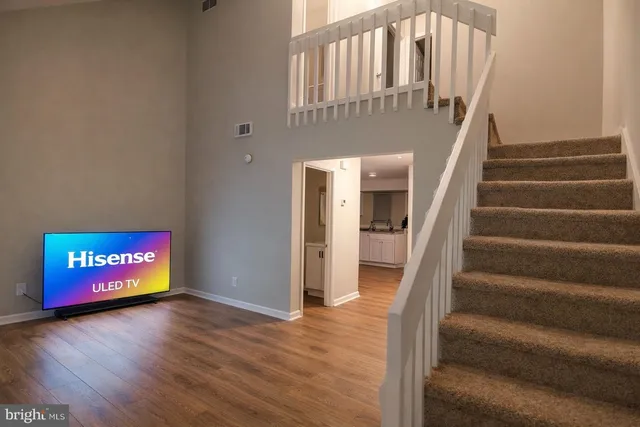 a view of an entryway with wooden floor