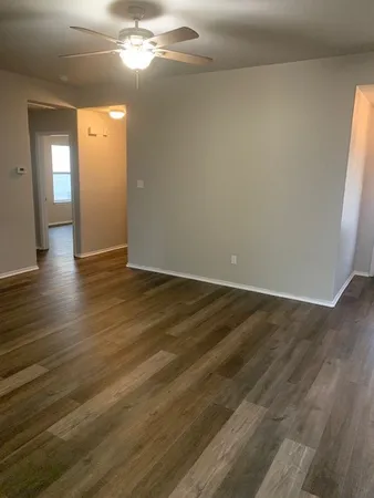 a view of a livingroom with wooden floor