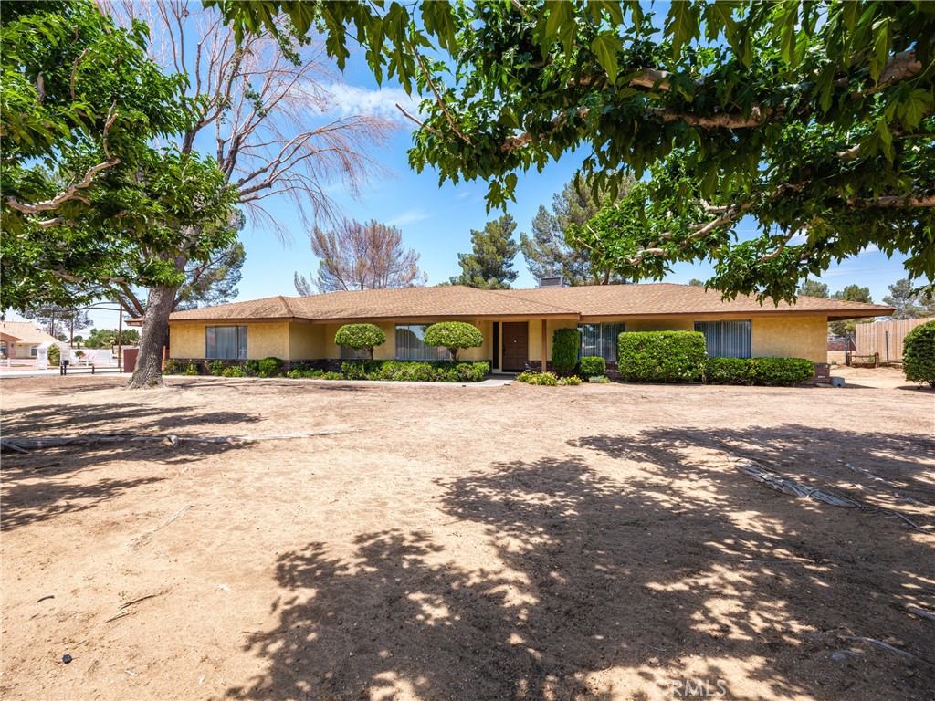19430 Tomahawk Road Apple Valley, CA 92307 - Photo 1 of 1 a front view of a house with a yard
