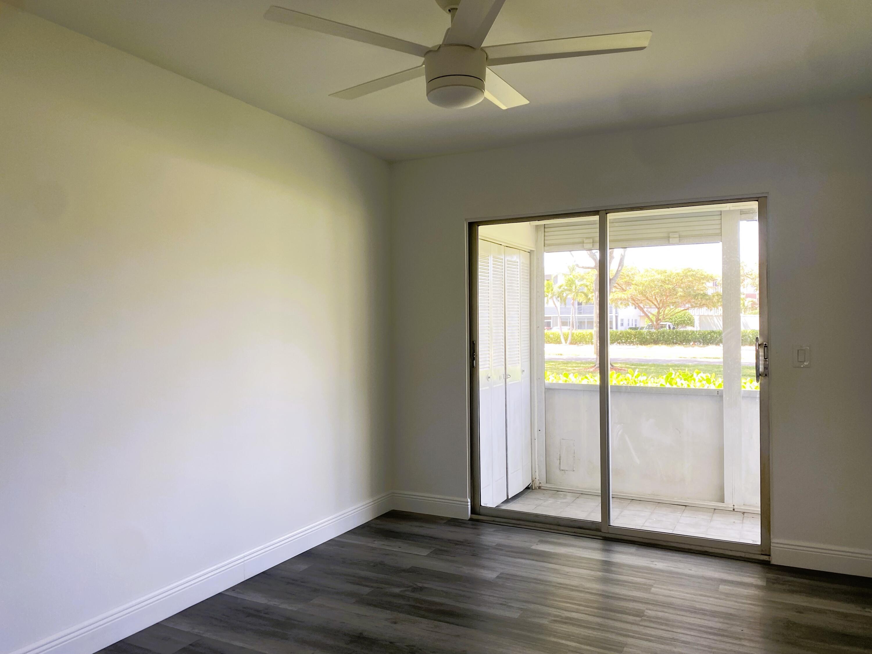 256 Mansfield F, Unit G Boca Raton, FL 33434 - Photo 14 of 40 GUEST BED LEADS TO PATIO