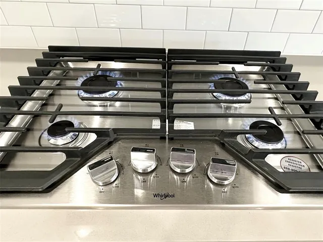 a close view of stove and cabinets