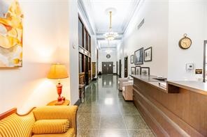 915 Franklin Street, Unit 9K Houston, TX 77002 - Photo 20 of 20 a large white room with many windows and furniture