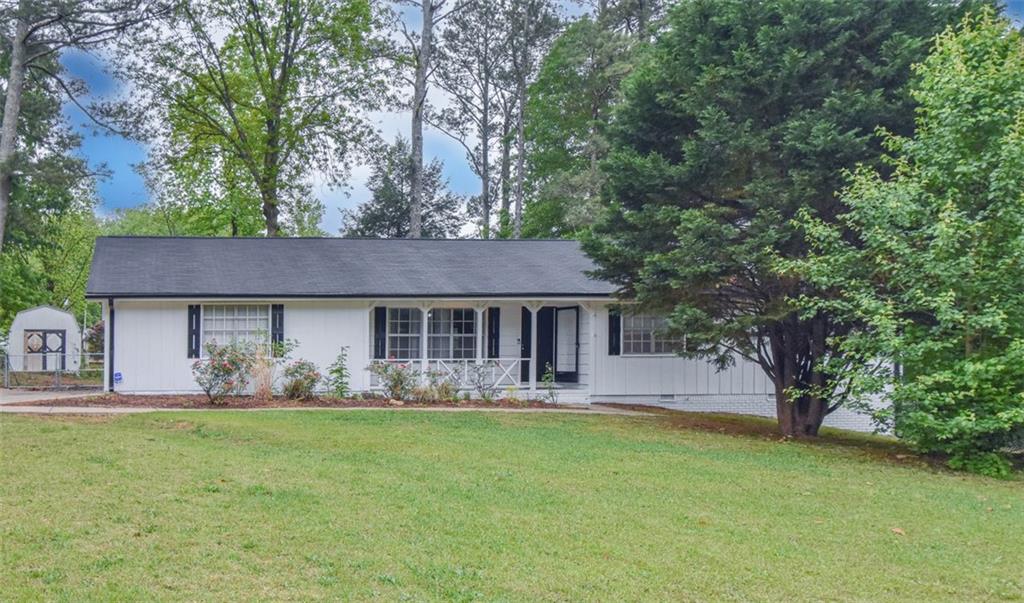 2379 Shire Court Austell, GA 30106 - Photo 1 of 1 a front view of a house with garden