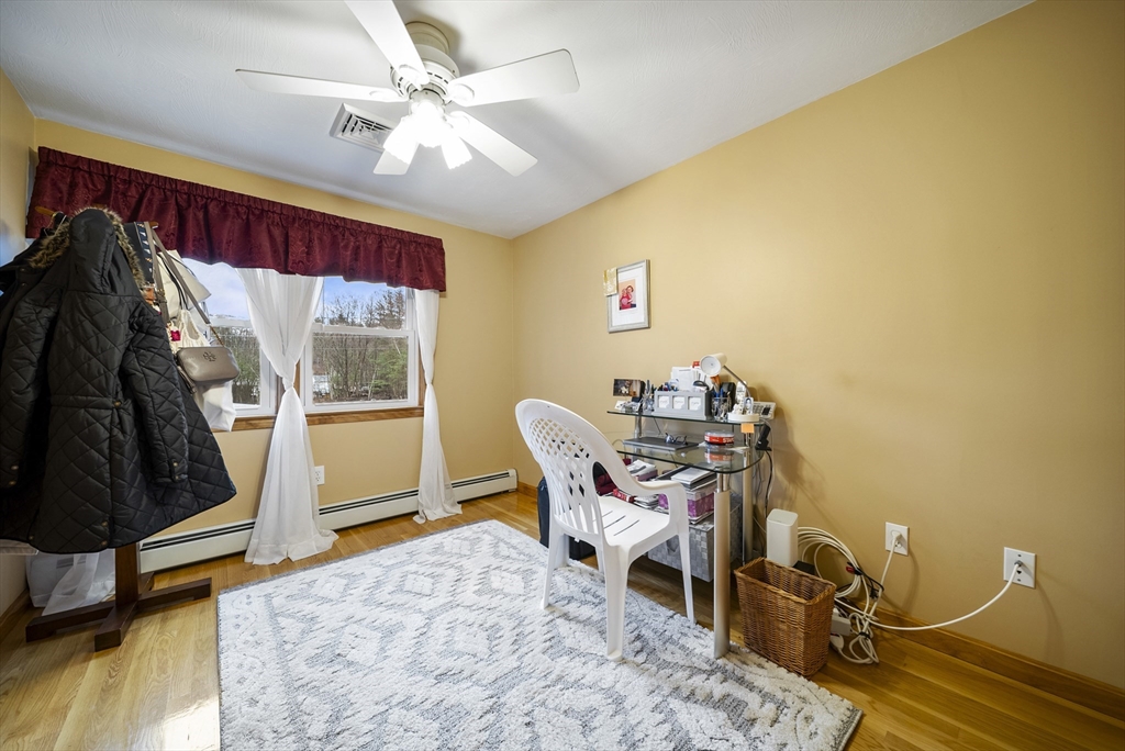 23 Echo Avenue Nashua, NH 03062 - Photo 16 of 38 a view of a workspace with furniture and a window