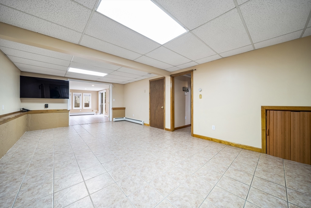 23 Echo Avenue Nashua, NH 03062 - Photo 22 of 38 a view of an empty room and a kitchen
