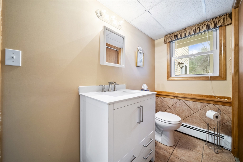 23 Echo Avenue Nashua, NH 03062 - Photo 23 of 38 a bathroom with a sink and mirror