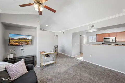 a living room with furniture and a large window