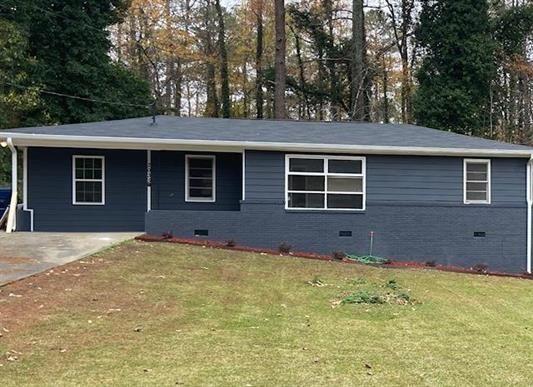 2035 Niskey Lake Road Southwest Atlanta, GA 30331 - Photo 1 of 1 a view of an house with backyard space and garden