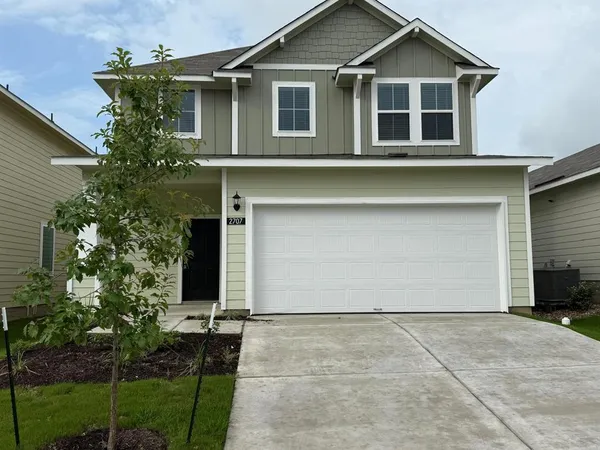 a house with trees in the background