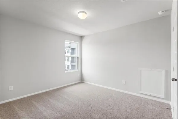 a bathroom with a shower and a sink