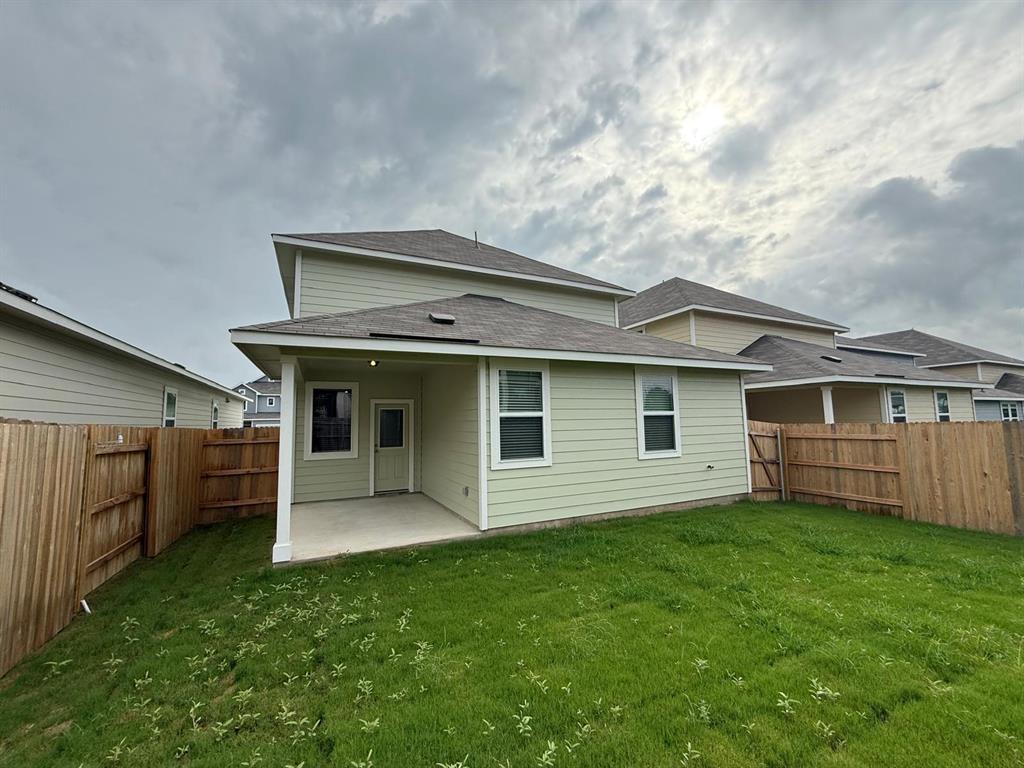 2707 Totley Road Pflugerville, TX 78660 - Photo 6 of 39 Rear view of property featuring a patio area, a fenced backyard, and a shingled roof