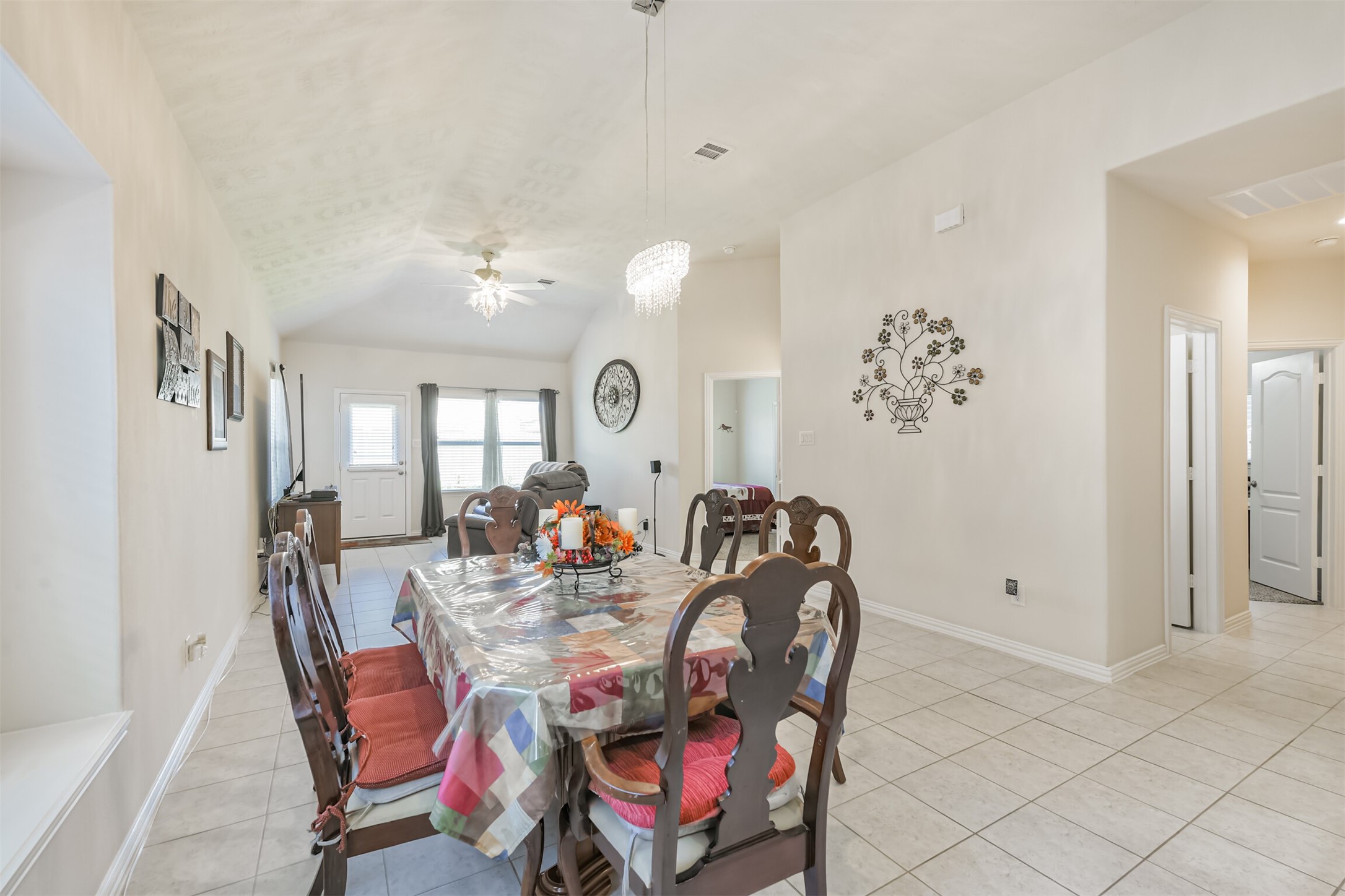7527 Windsor Valley Lane Houston, TX 77049 - Photo 15 of 35 a view of a dining room with furniture and chandelier