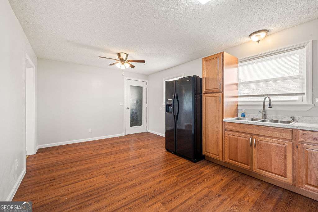 31 Jackson Way Fort Oglethorpe, GA 30742 - Photo 14 of 51 a view of a kitchen with a sink and a refrigerator