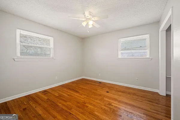 an aerial view of a house with garden space and street view