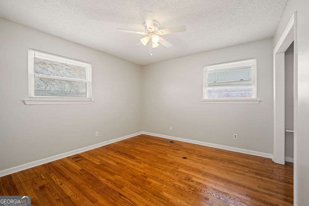 31 Jackson Way Fort Oglethorpe, GA 30742 - Photo 22 of 51 a view of empty room with wooden floor
