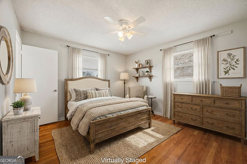 31 Jackson Way Fort Oglethorpe, GA 30742 - Photo 5 of 51 a spacious bedroom with a bed and a chandelier