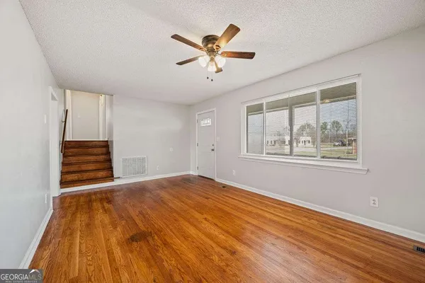 a view of a kitchen with a sink cabinet and a window