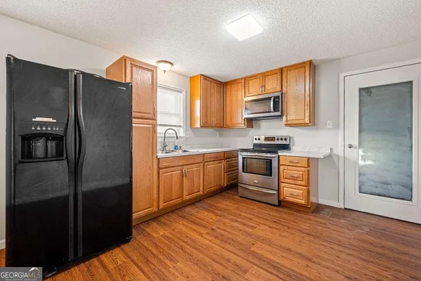 a view of entryway with wooden floor
