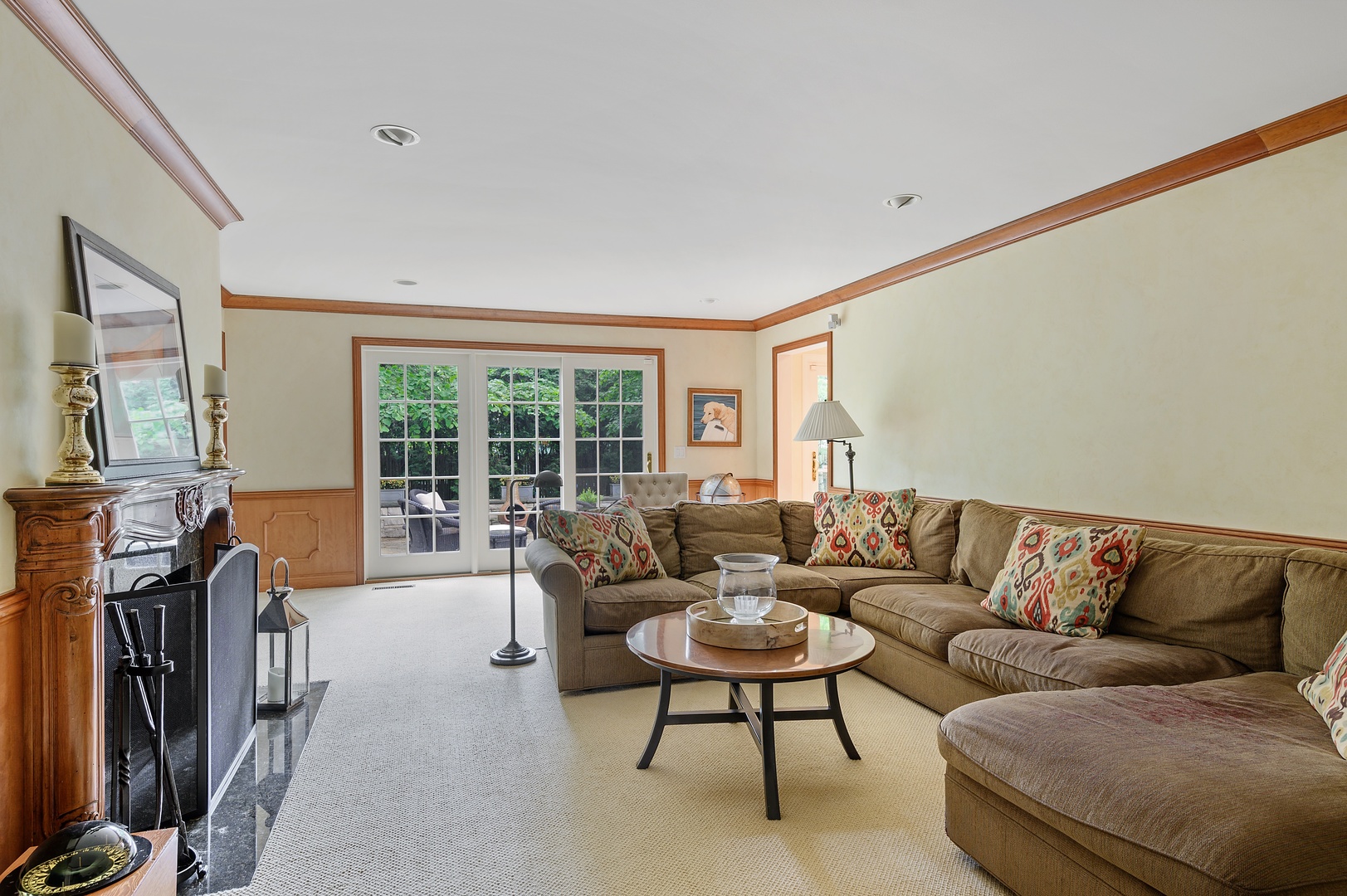 1210 Sunset Road Winnetka, IL 60093 - Photo 14 of 33 a living room with furniture a flat screen tv and a large window