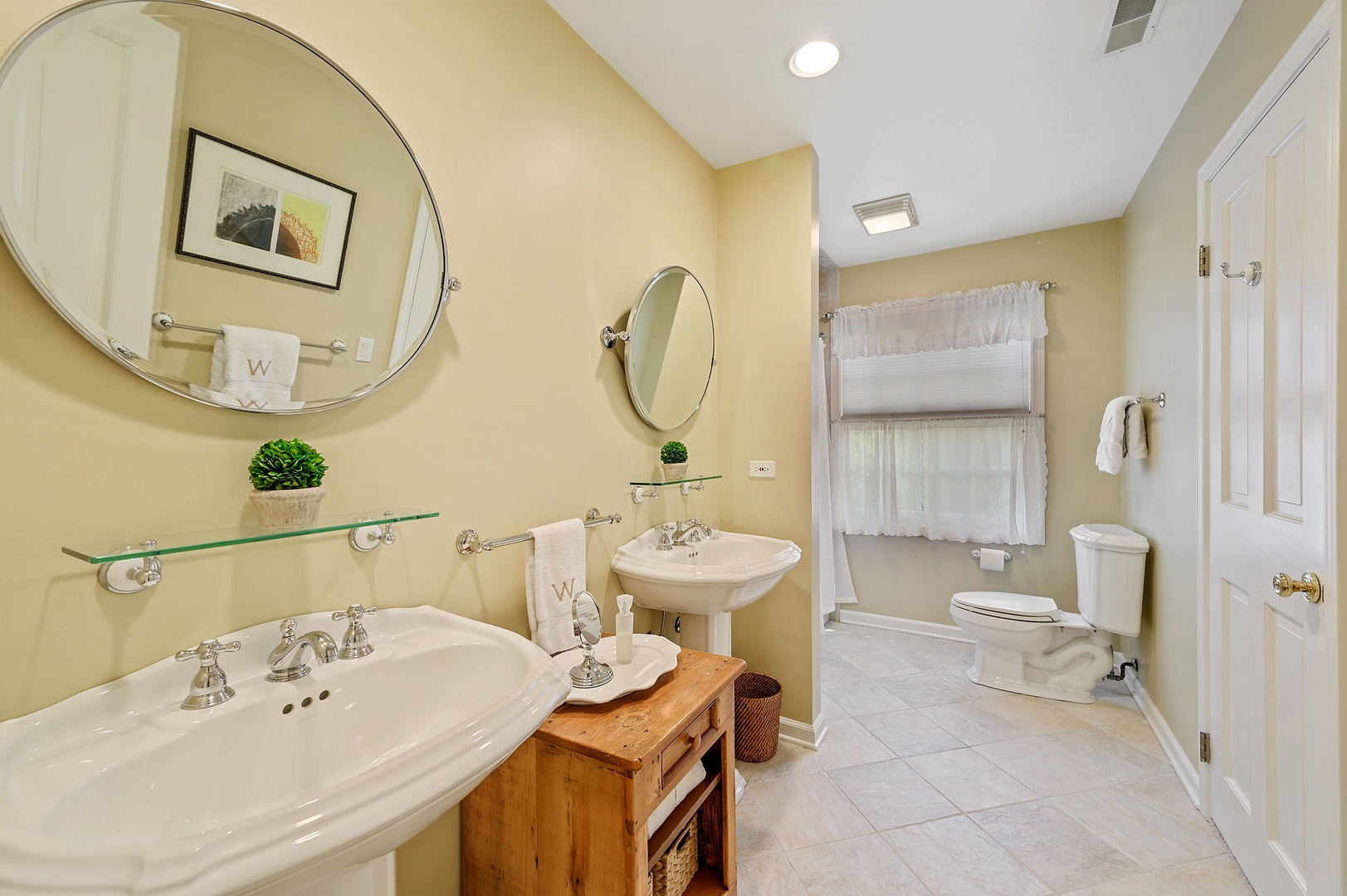 1210 Sunset Road Winnetka, IL 60093 - Photo 22 of 33 a bathroom with a sink a toilet and a mirror