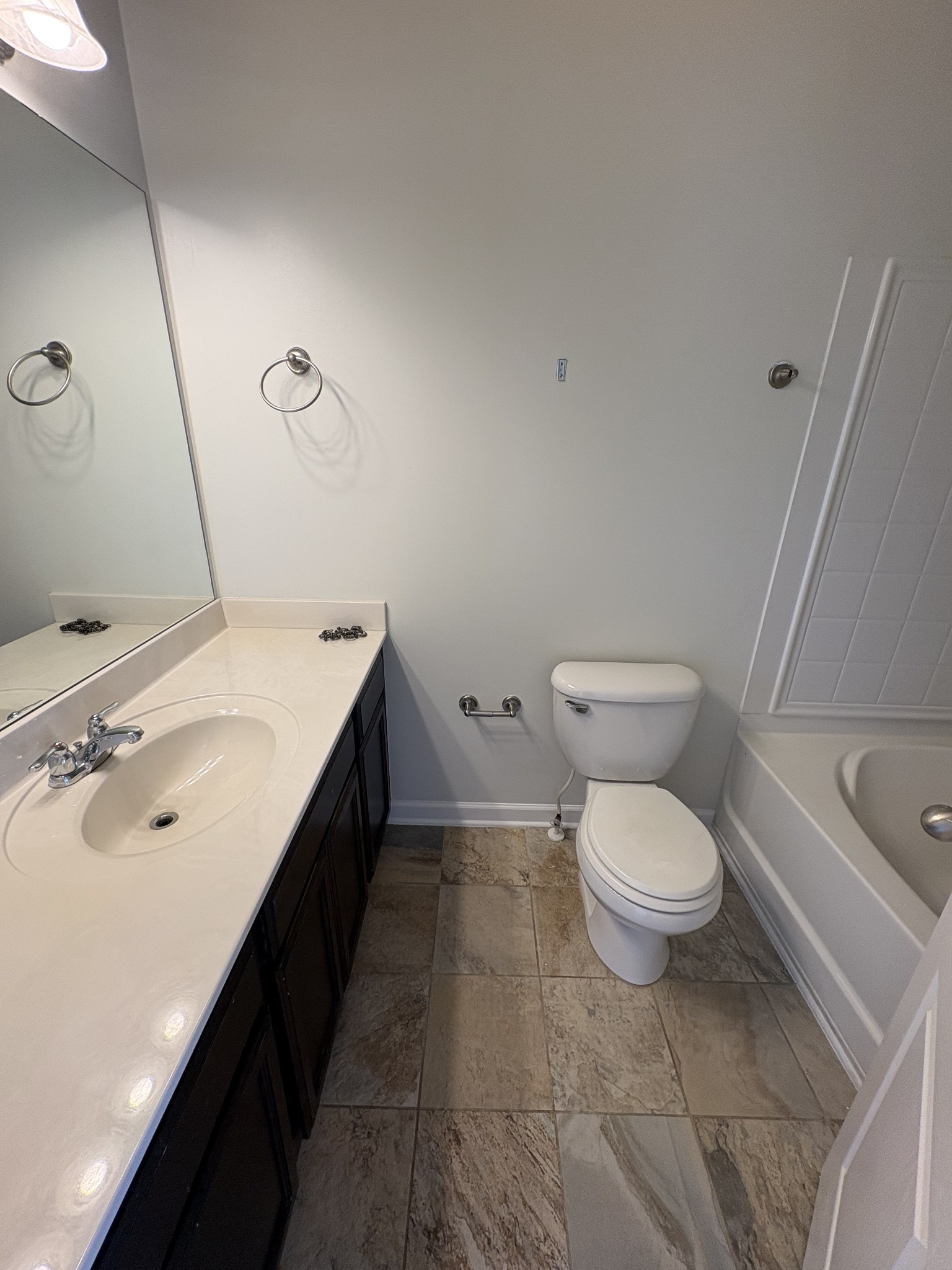 735 Tulip Grove Road, Unit 303 Hermitage, TN 37076 - Photo 11 of 16 a bathroom with a sink a toilet and vanity