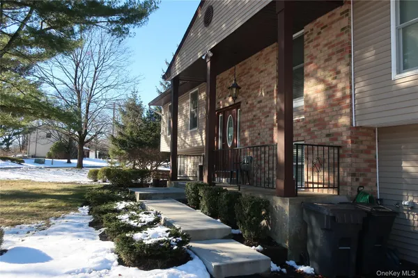 a view of a pathway with a backyard