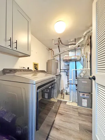 a utility room with washer and dryer