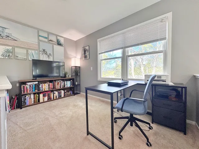 a workspace with furniture and a book shelf