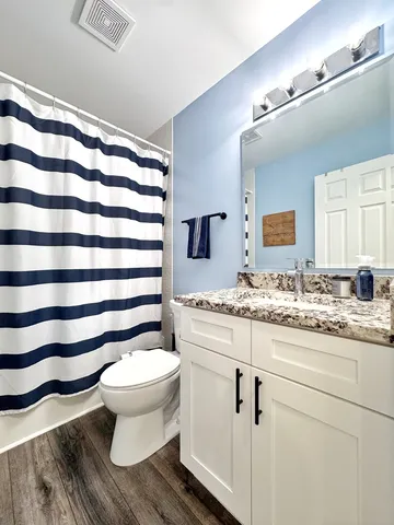 a bathroom with a toilet and a sink
