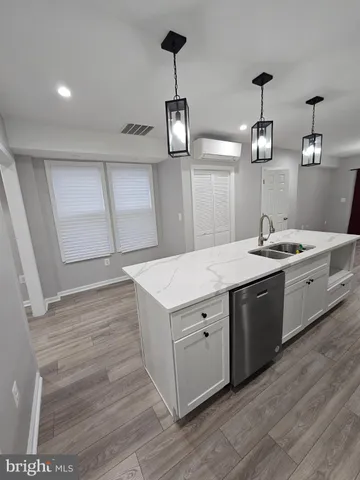 a kitchen with a sink and cabinets