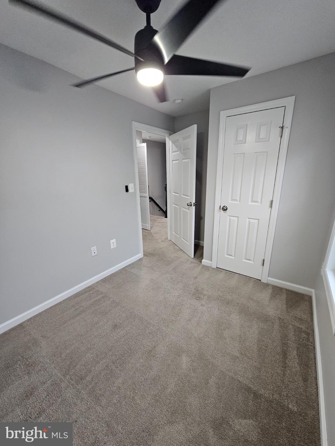 909 45th Place Northeast Washington, DC 20019 - Photo 21 of 36 a view of an empty room with a ceiling fan