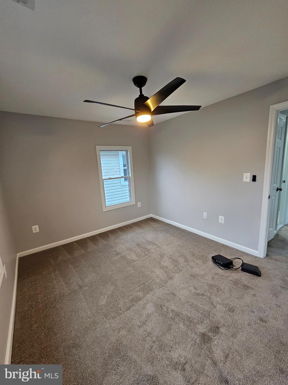 909 45th Place Northeast Washington, DC 20019 - Photo 26 of 36 an empty room with a ceiling fan and window