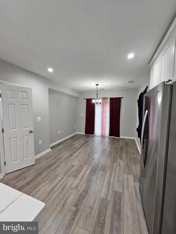 a view of a livingroom with a refrigerator