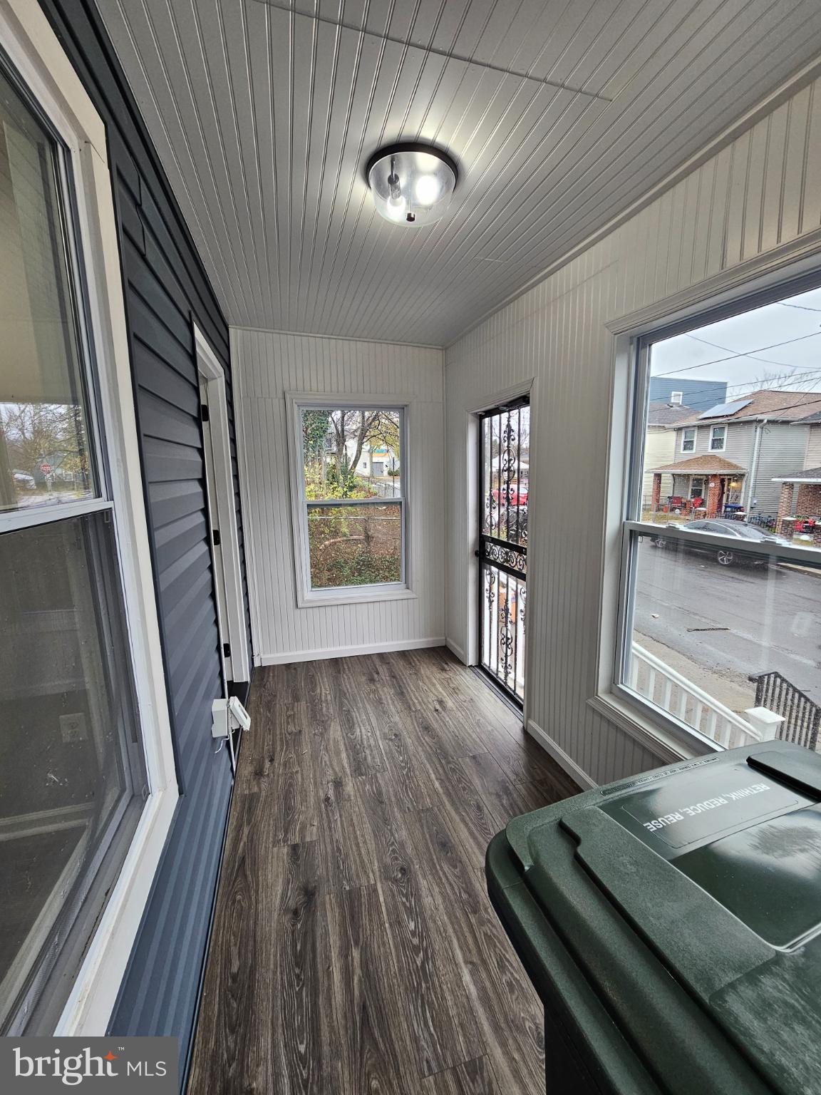 909 45th Place Northeast Washington, DC 20019 - Photo 4 of 36 a view of an empty room with wooden floor and a window