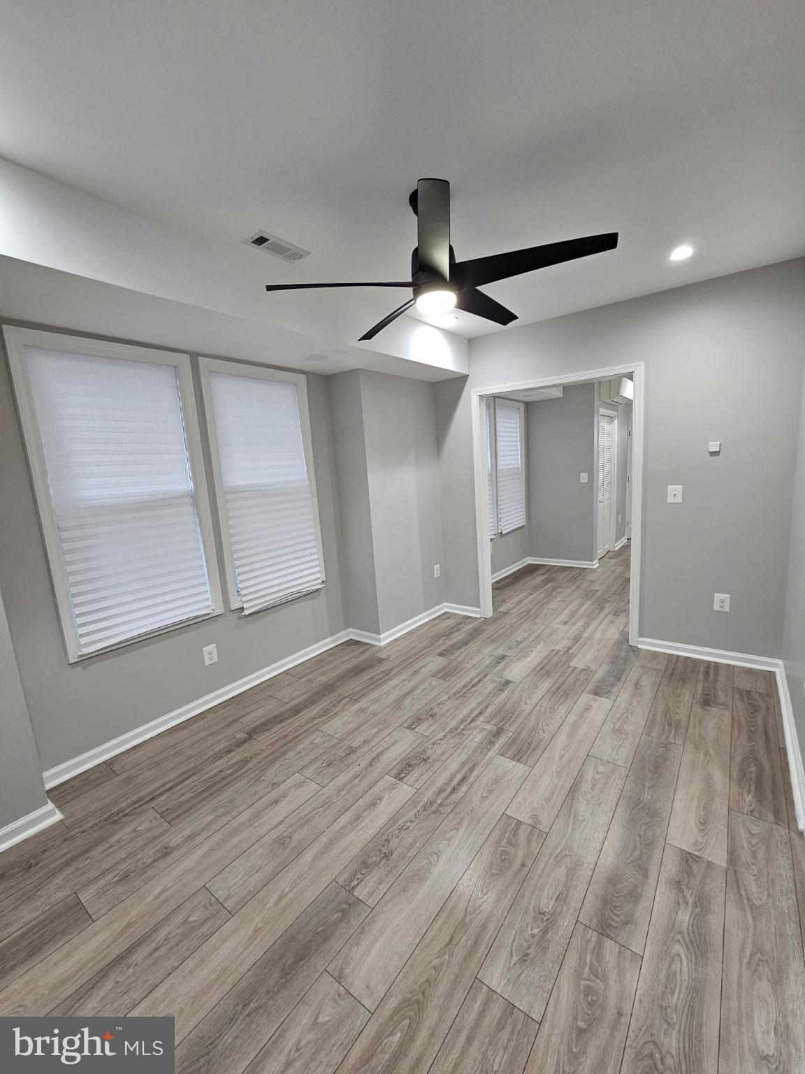 909 45th Place Northeast Washington, DC 20019 - Photo 7 of 36 wooden floor in an empty room with a window