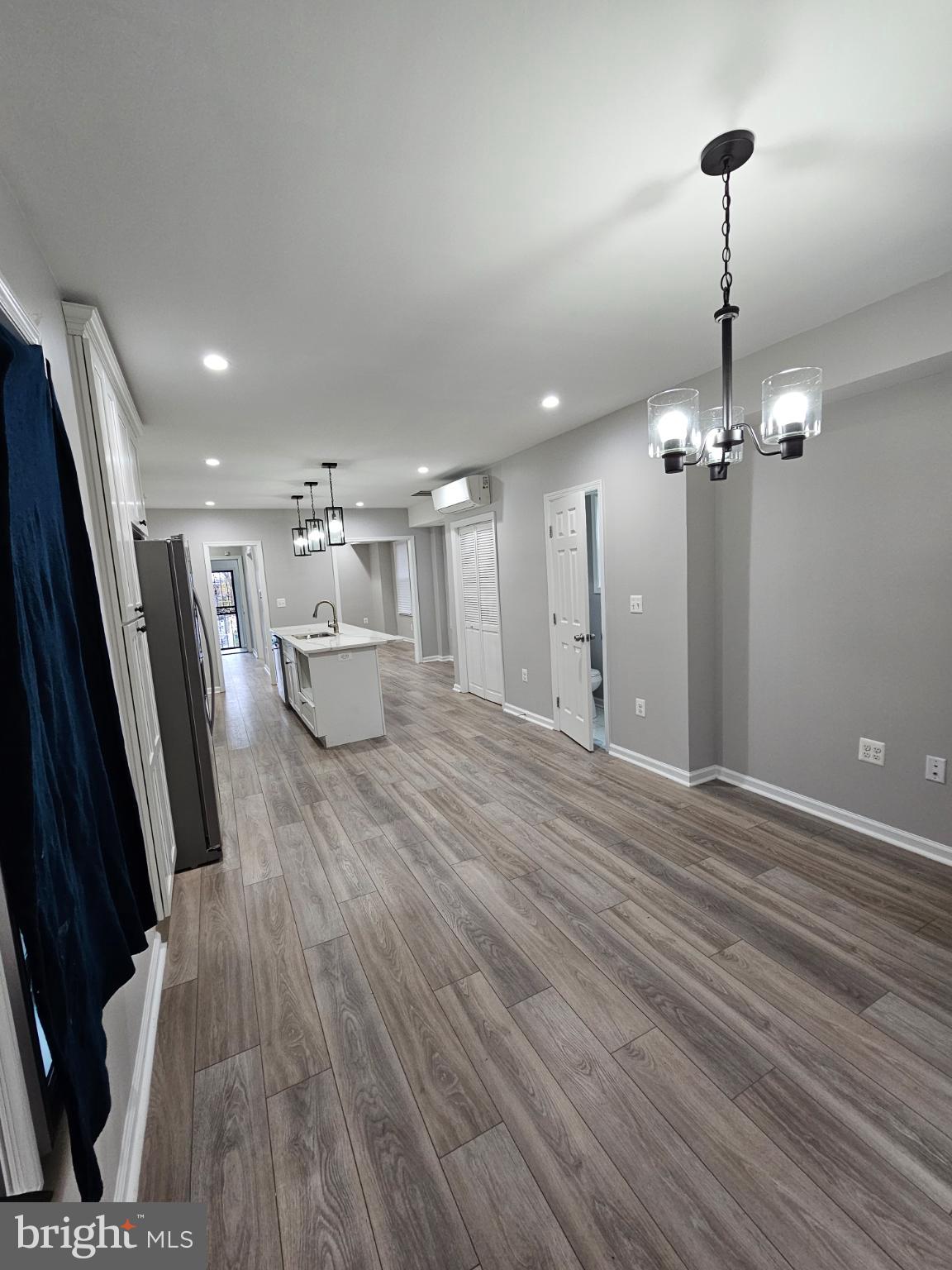 909 45th Place Northeast Washington, DC 20019 - Photo 9 of 36 a view of a room with wooden floor and potted plant