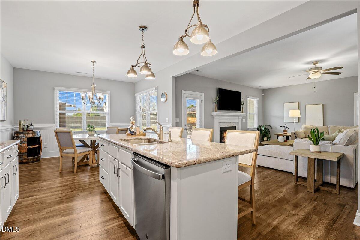 88 Heath Road Lillington, NC 27546 - Photo 34 of 54 a view of living room kitchen island stainless steel appliances and living room view