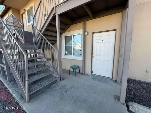 a view of front door with stairs