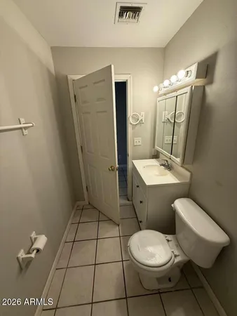 a bathroom with a toilet a sink and shower