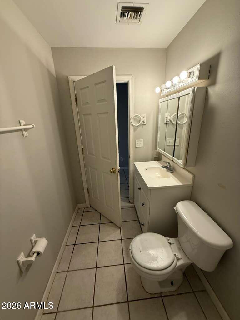 1810 East 8th Street, Unit C Douglas, AZ 85607 - Photo 11 of 14 a bathroom with a toilet a sink and shower