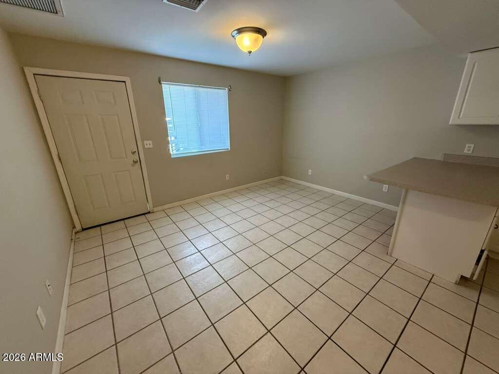 1810 East 8th Street, Unit C Douglas, AZ 85607 - Photo 2 of 14 a view of an empty room and wooden floor