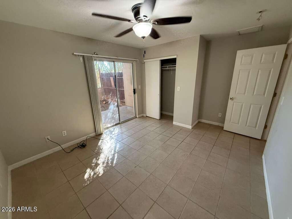 1810 East 8th Street, Unit C Douglas, AZ 85607 - Photo 8 of 14 a view of empty room with wooden floor and fan