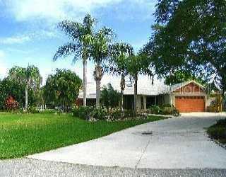 3687 Clematis Road Venice, FL 34293 - Photo 1 of 1 a front view of a house with a garden