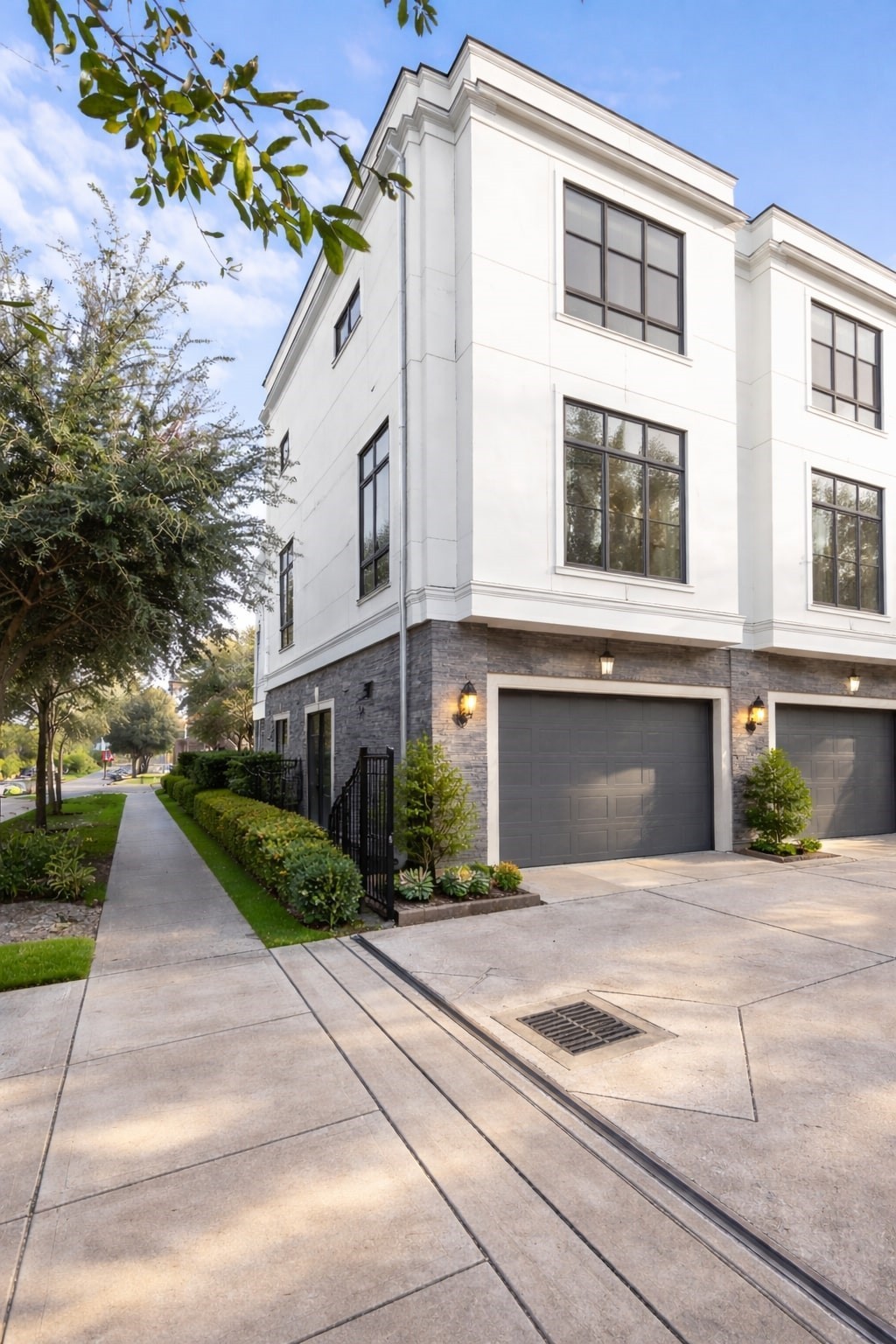 a front view of a house with a yard and a garage