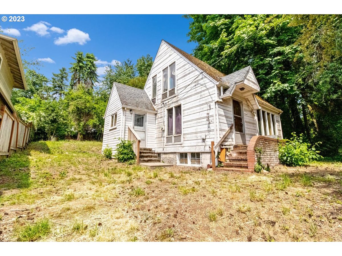 9429 Southwest View Point Terrace Portland, OR 97219 - Photo 1 of 12 a view of a house with a yard