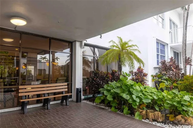 an aerial view of a residential building and lake view